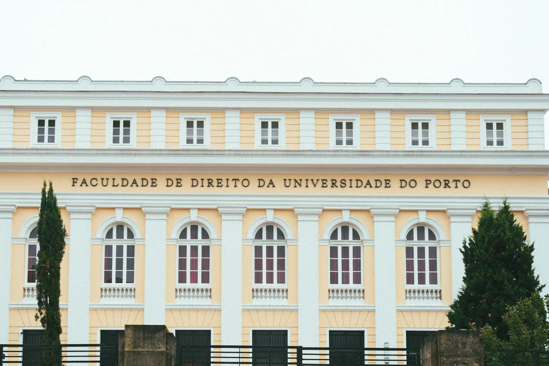 Facade of the Faculty of Law at the University of Porto, showcasing classic architecture.